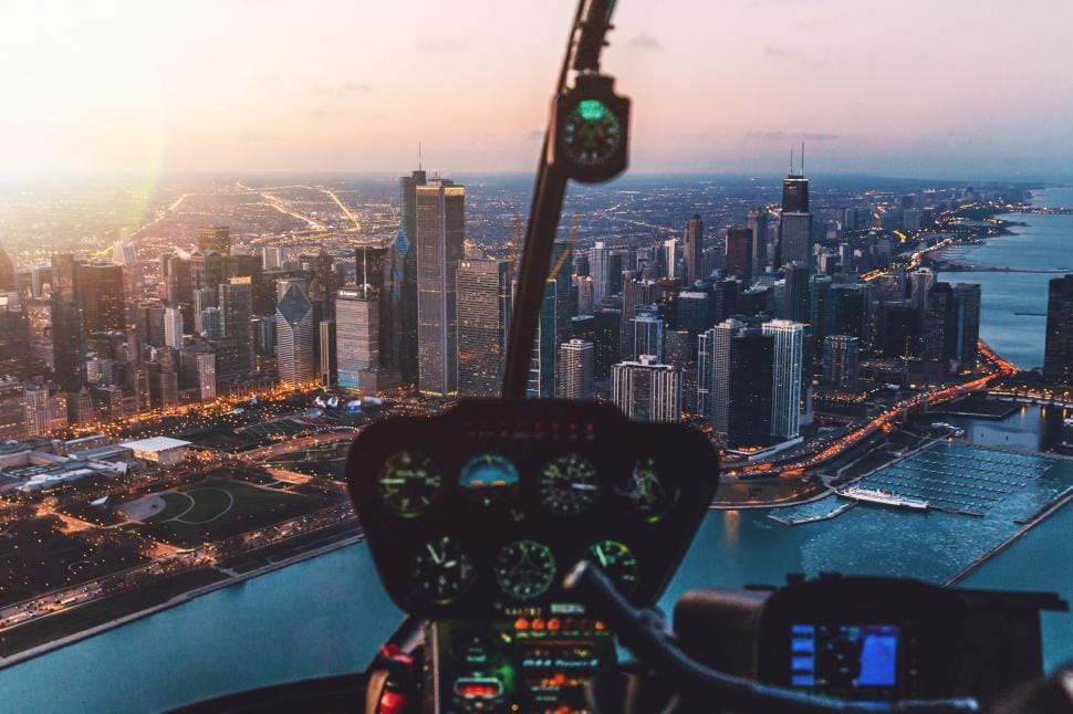 Helicopter in flight over a city