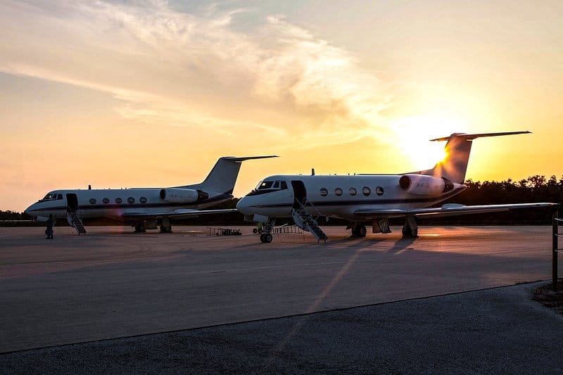 Aircraft on a lit apron at night